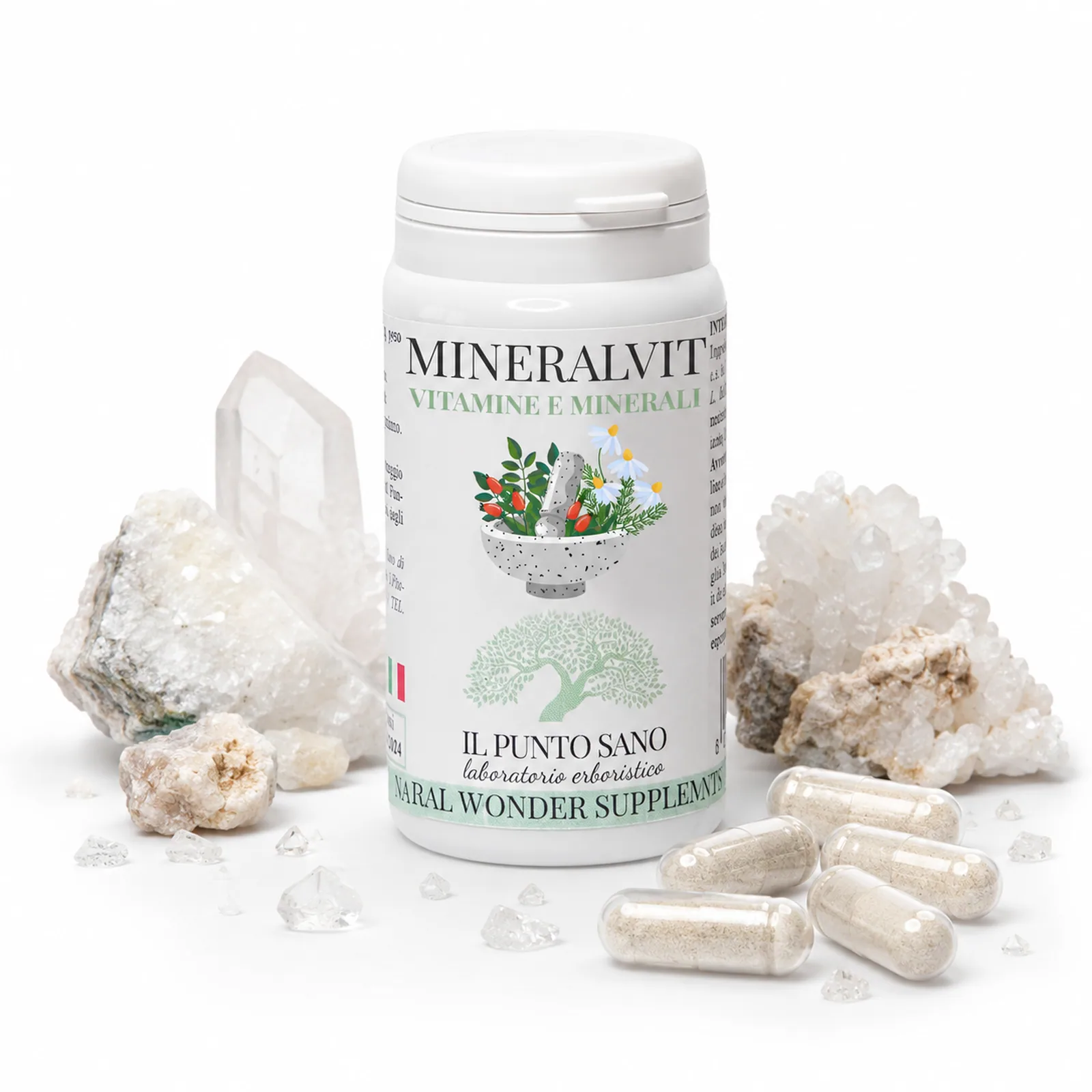 Mineralvit composizione creativa con cristalli Composizione creativa di Mineralvit Il Punto Sano con flacone adagiato tra capsule e cristalli minerali chiari, immagine evocativa del contenuto in vitamine e minerali.